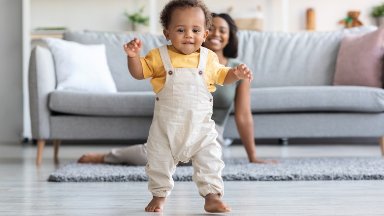 baby taking first steps