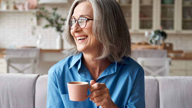 older woman drinking coffee