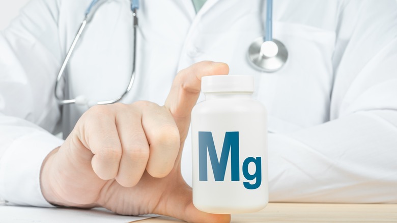Doctor holding Mg bottle