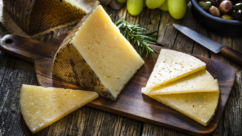 slices of Manchego cheese on a cutting board