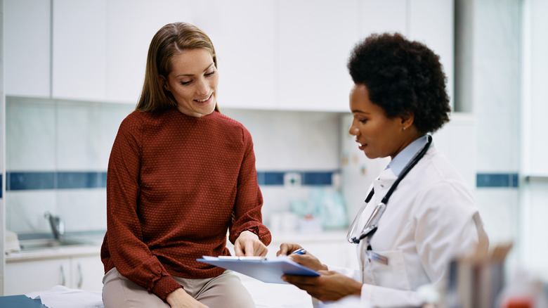 doctor talking with woman about cervical cancer screening