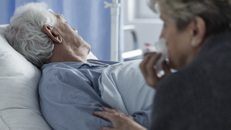 Elderly man in hospital bed