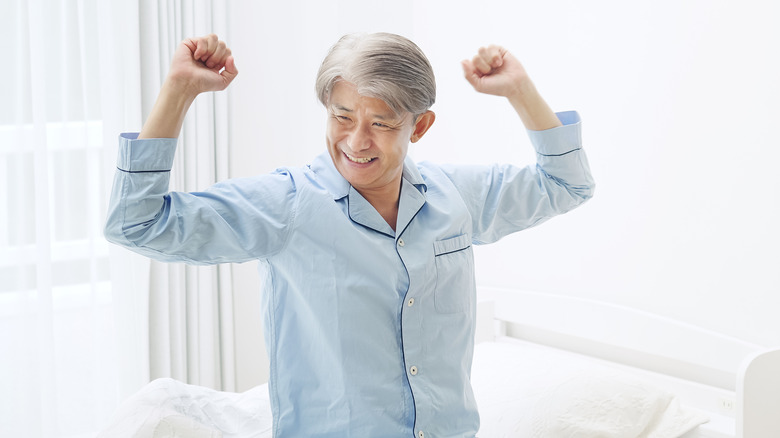 person waking up feeling refreshed 