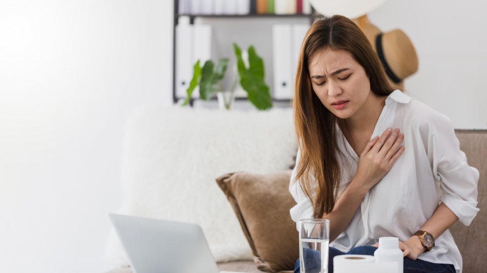 Woman feeling chest pains