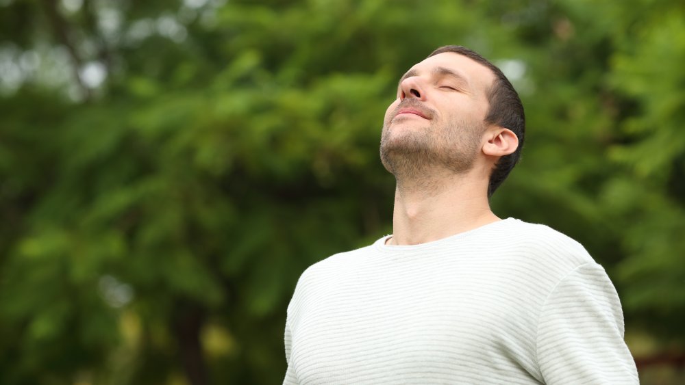 Man meditating outdoors