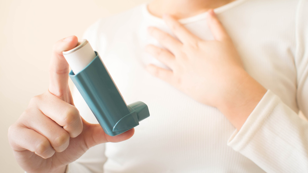 Closeup of a woman with asthma inhaler