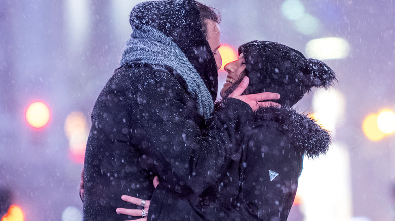 couple kissing in snow