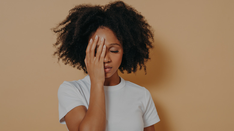 woman experiencing a headache