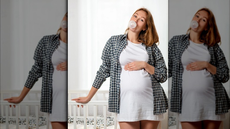 Pregnant woman chewing sugar-free gum