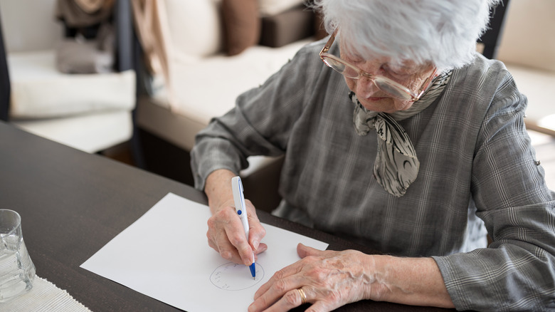 senior woman doing cognitive test 