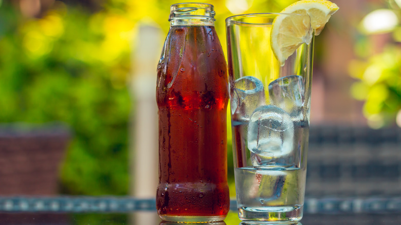 bottle of iced tea with glass of ice