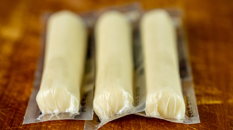 three individually wrapped string cheese