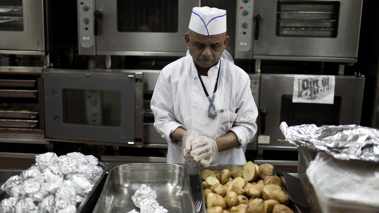 Worker with potatoes