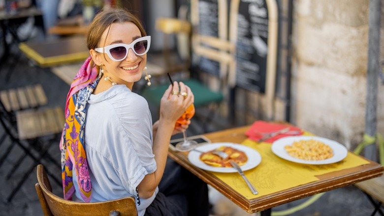 Woman eating at Italian restaurant