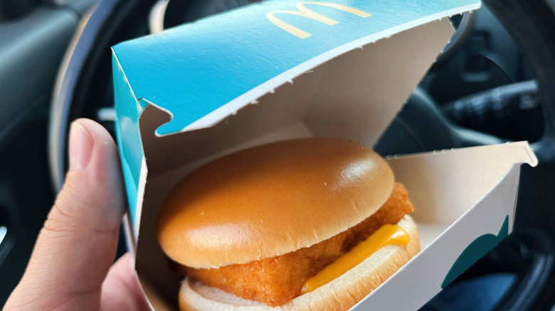 hand holding McDonald's filet o fish in box