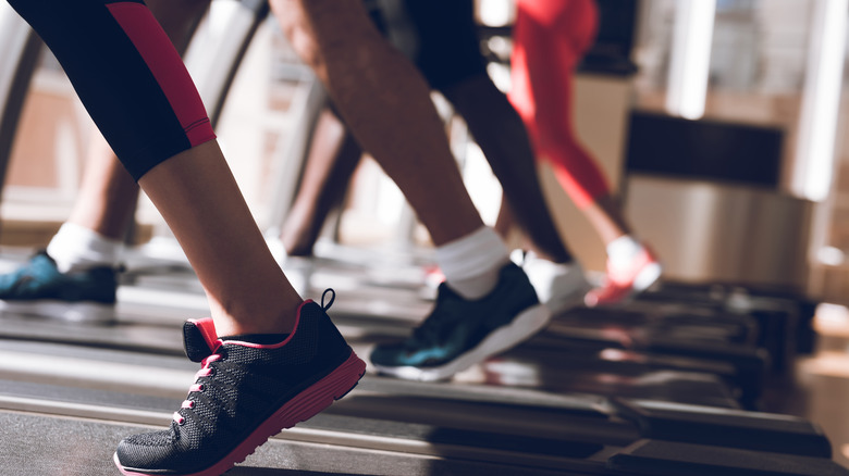 Legs walking on treadmills 