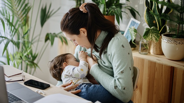 breastfeeding mother at her desk