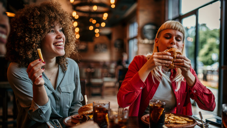 Friends eating burgers and fries