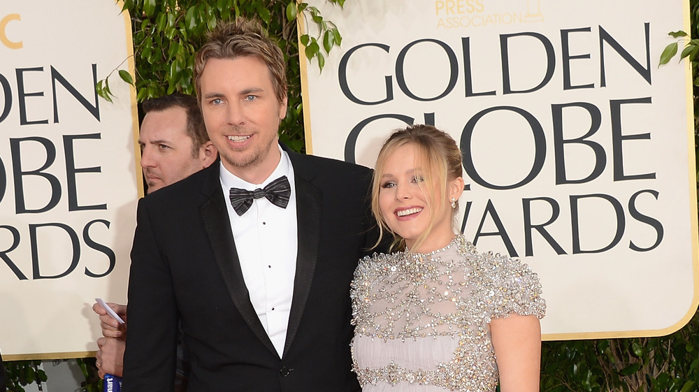 Close up image of Kristen Bell and husband Dax Shepard together at a premier