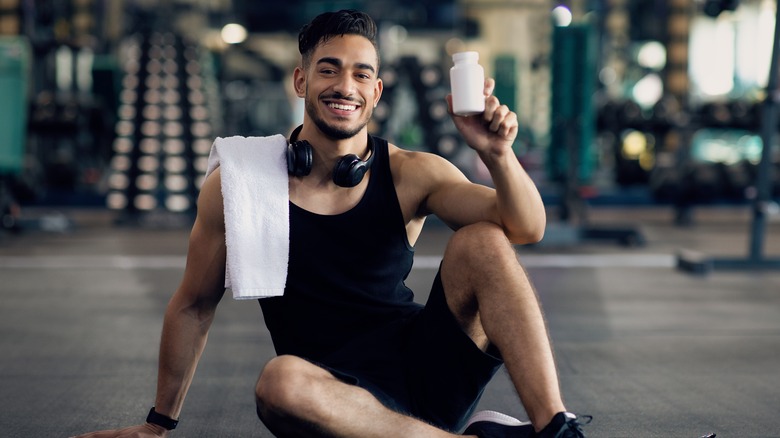 Man holding pill bottle