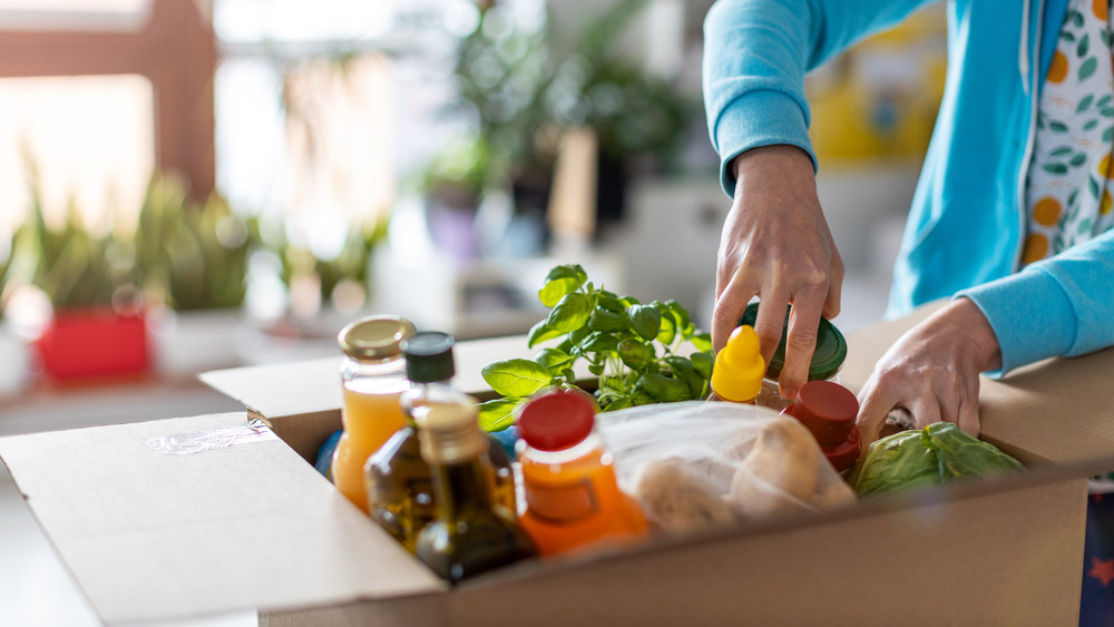 Woman opening meal delivery