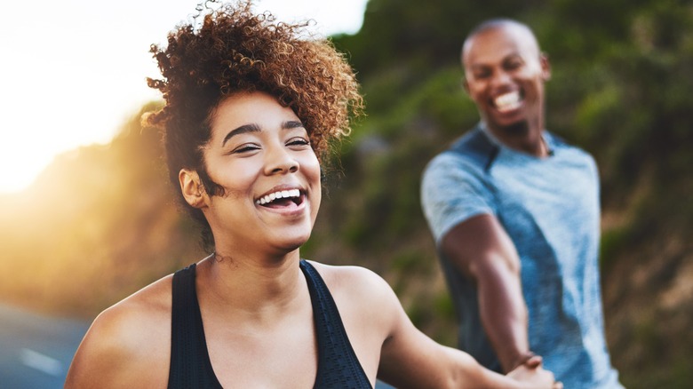 young couple exercising and feeling better