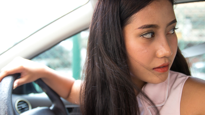 Woman reversing her car