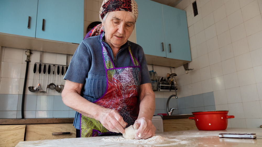 Older woman baking