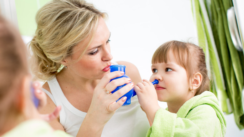 little girl and mom with neti pot