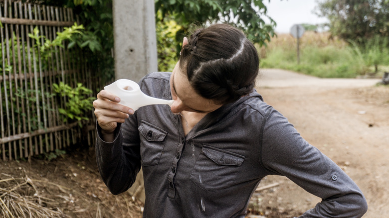 Woman using a neti pot