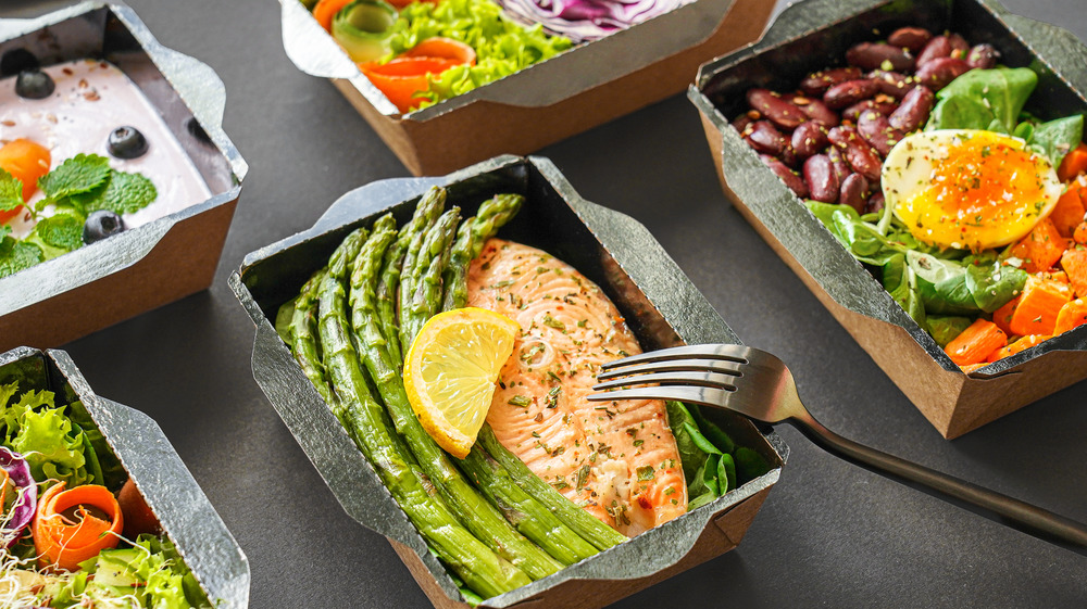 A few healthy meals in containers on a table