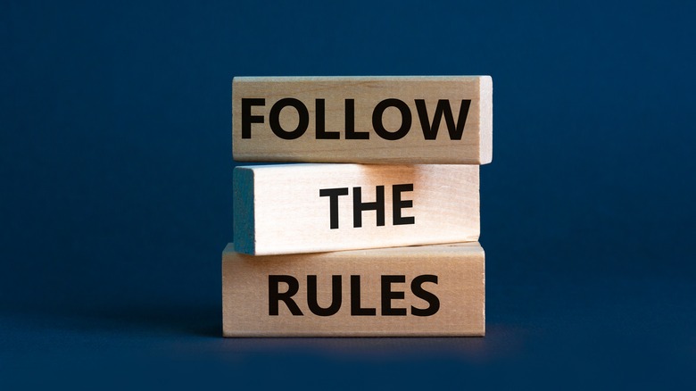 Follow the rules text on wooden blocks