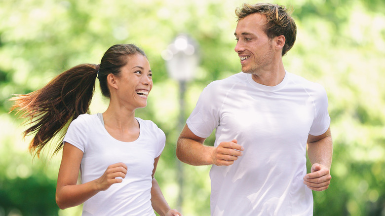 couple running together outdoors