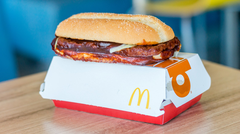 McDonalds McRib sandwich on cardboard box