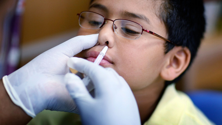 child receives nasal spray flu vaccine