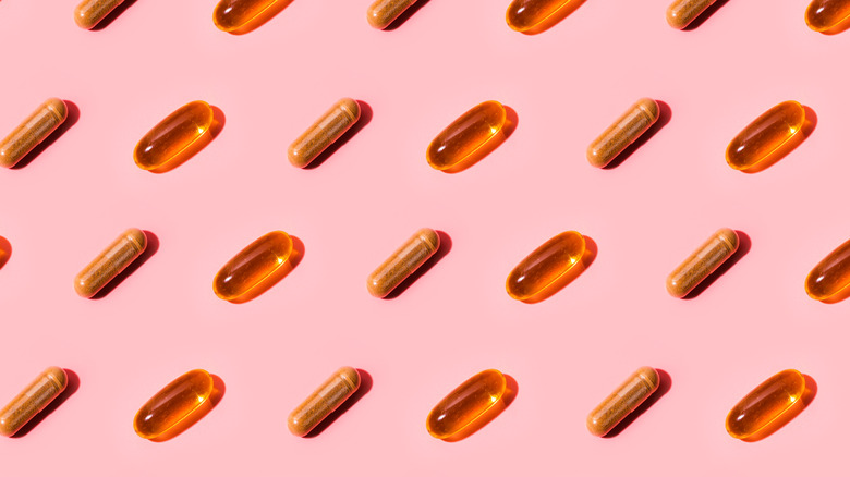 Pills on pink background