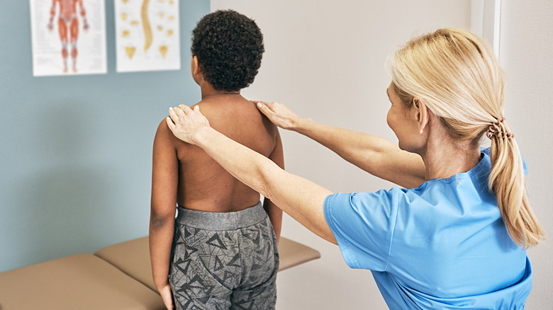 Boy getting scoliosis corrected