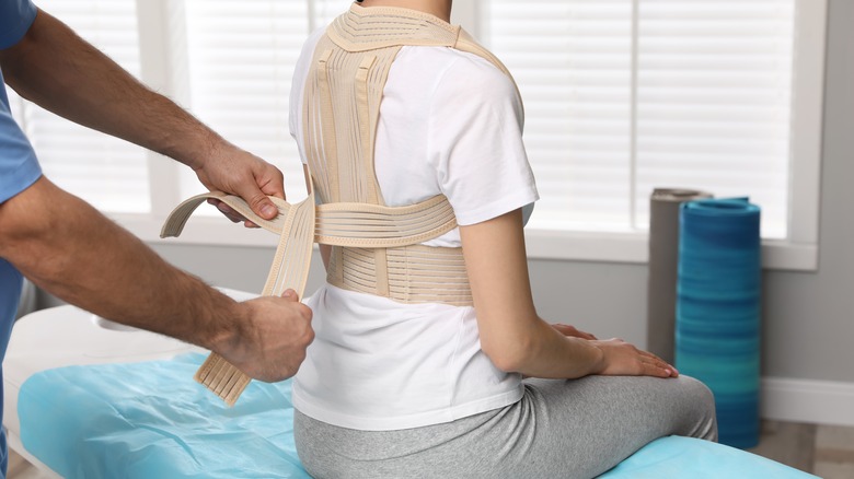 Person getting fitted with a scoliosis brace