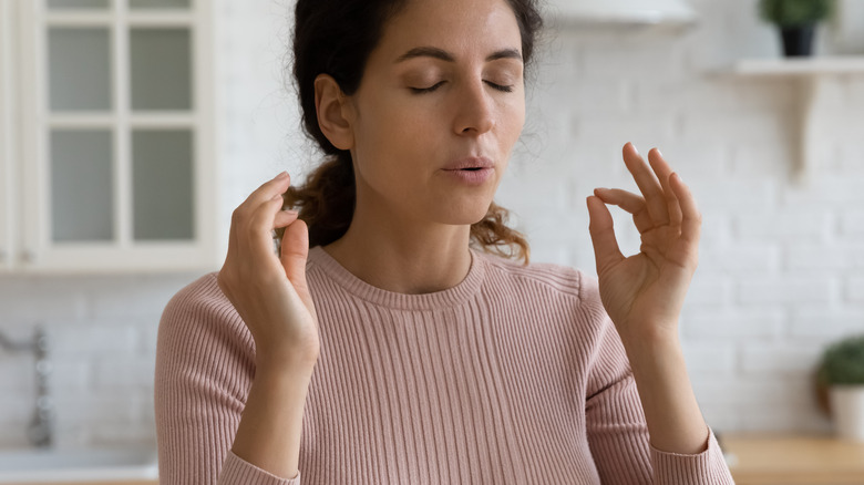 Woman taking deep breaths