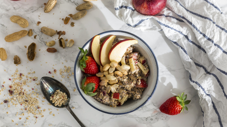 bowl of oatmeal with apples and nuts