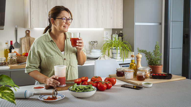 woman enjoying her fresh tomato juice