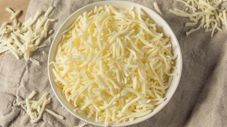 Bowl of shredded mozzarella cheese