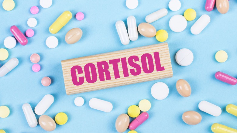 colored pills surrounding the word cortisol 