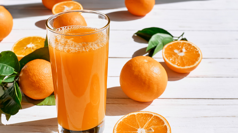 A tall glass of orange juice