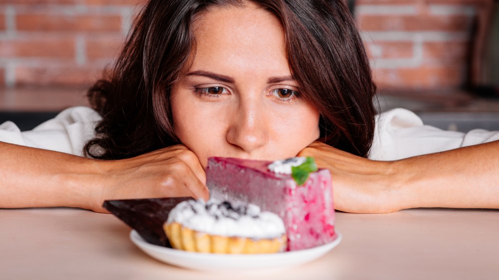 woman with cravings, one of the unexpected effects your breakup can have on your body