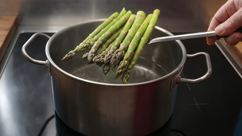 green asparagus in boiling water