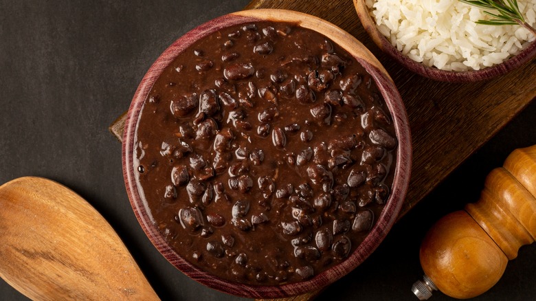 black bean stew in wooden bowl