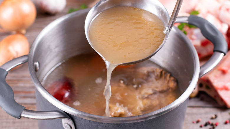 bone broth scooped with ladle