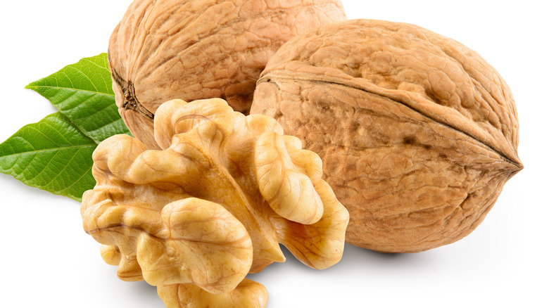 shelled and unopened walnuts