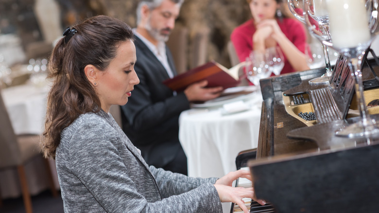 Pianist playing in restaurant